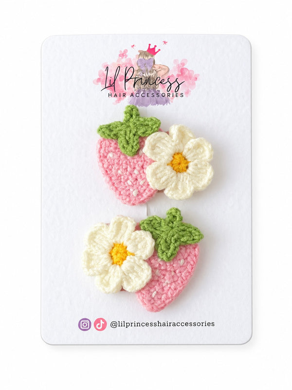 Pink version of Strawberry and Daisy Crochet Hair Clips shown together