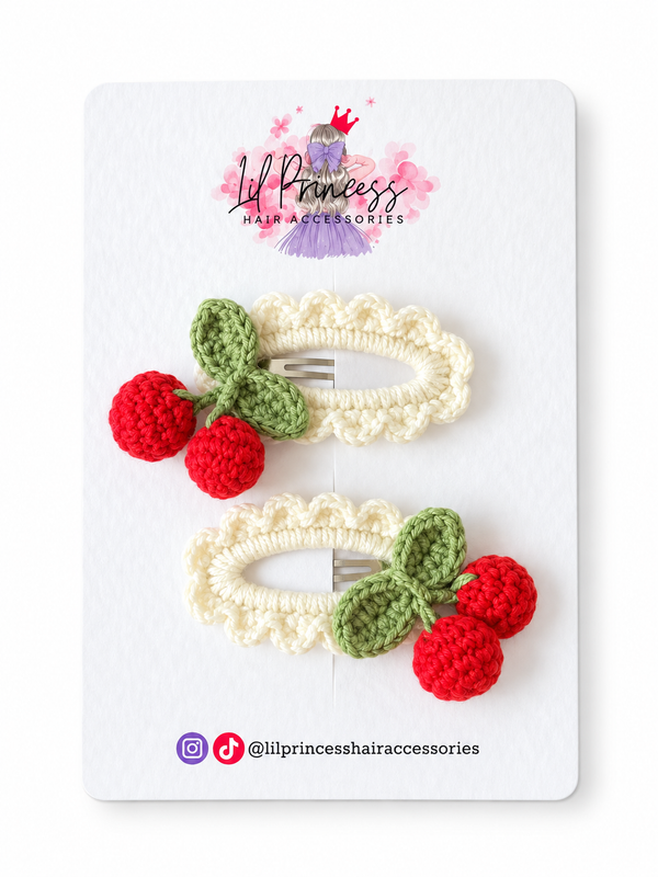 Red version of Cherry Crochet Hair Clips in Pink or Red shown together