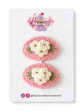 Pink version of Floral Crochet Hair Clips in Red or Pink shown together