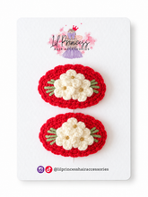 Red version of Floral Crochet Hair Clips in Red or Pink shown together