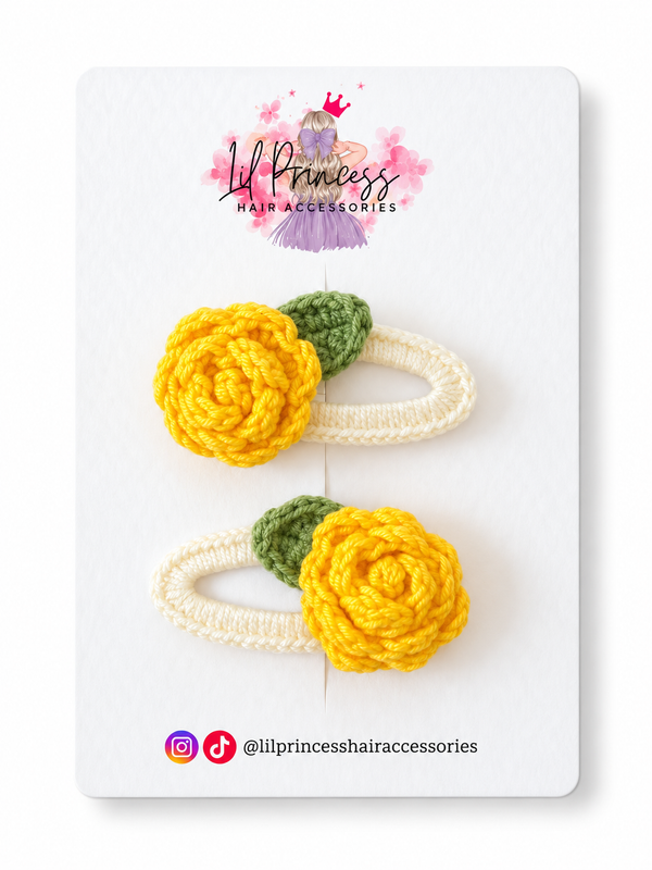 Yellow version of Crochet Rose Hair Clips in Yellow or Purple shown together